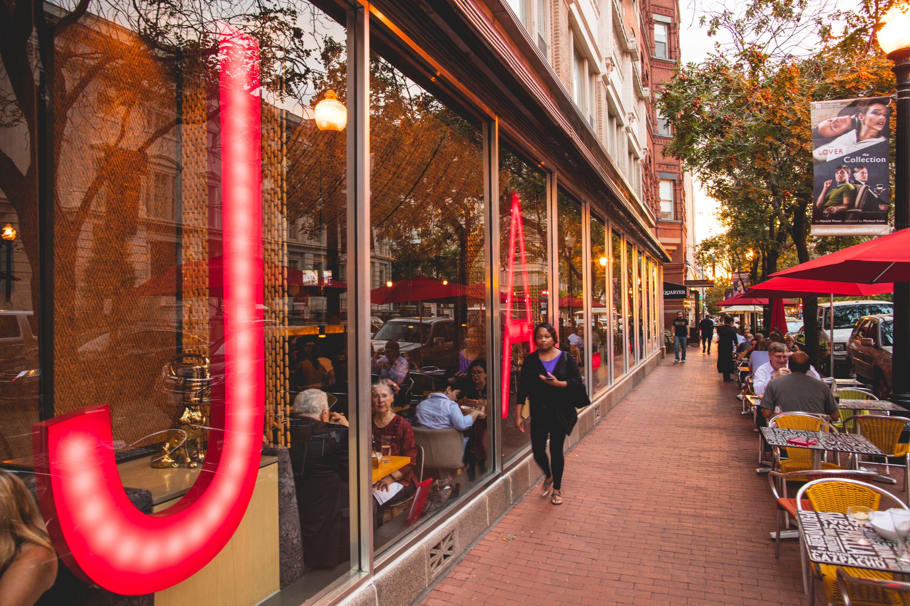 A person walking past Jaleo restaurant in Penn Quarter