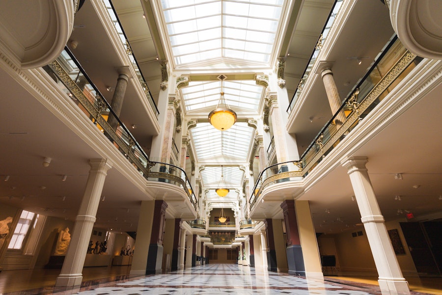An ornate museum corridor with high ceilings and classic architecture at the Smithsonian American Art Museum and National Portrait Gallery.