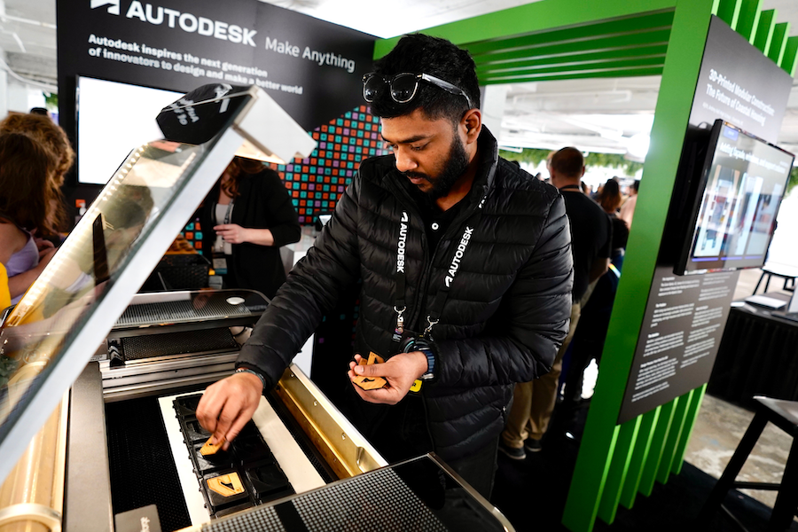 A person tinkers with a display.