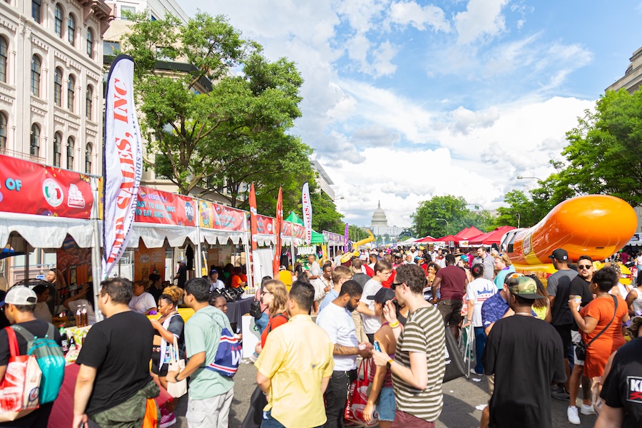 Crowds gather around tents along Pennsylvania Avenue at the Giant National BBQ Battle in Washington, DC.