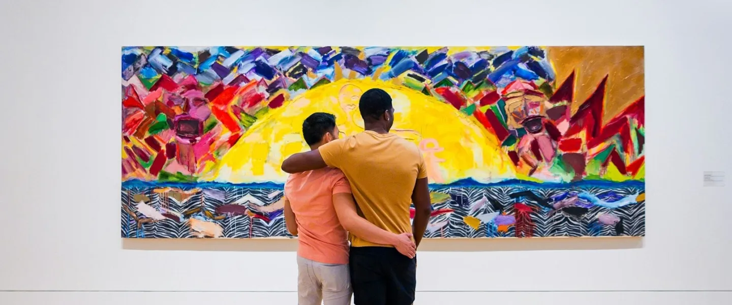 A couple looks at a colorful painting at the Phillips Collection.