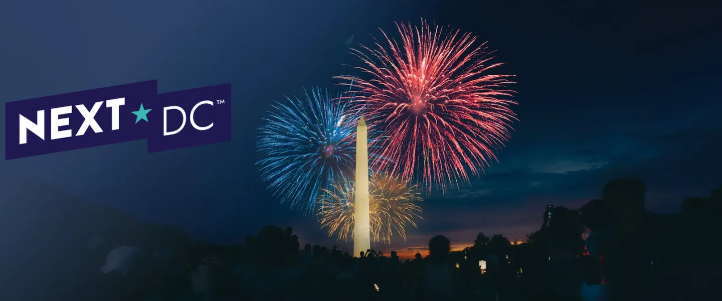 People view fireworks over the Washington Monument, with a logo for NEXTDC laid over the image. 