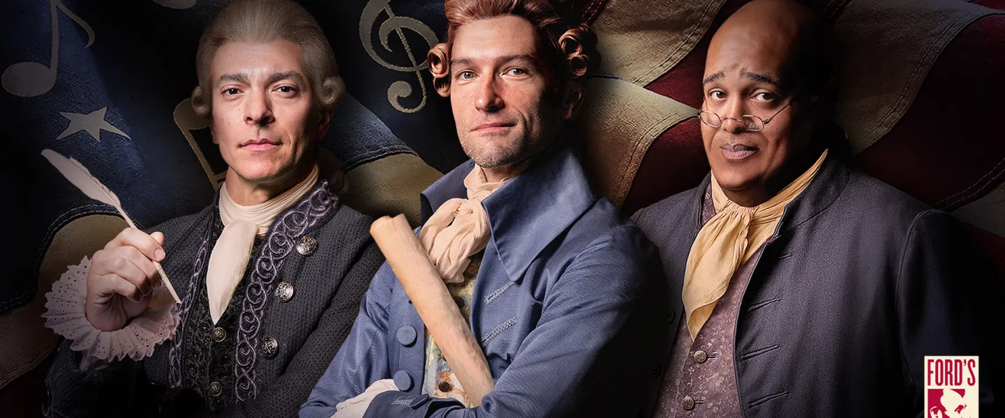 Three colonial-era men posed against an American flag backdrop, holding a document