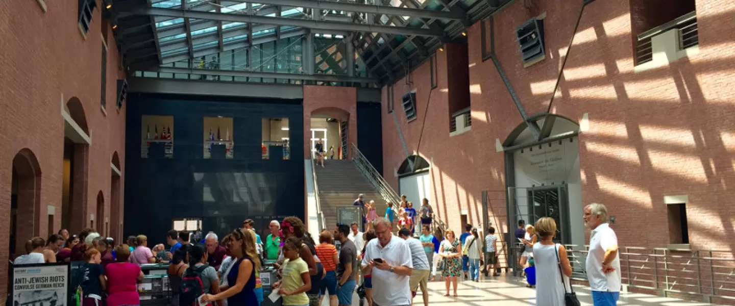 Visitors stand in the atrium of the United States Holocaust Memorial Museum in DC. 