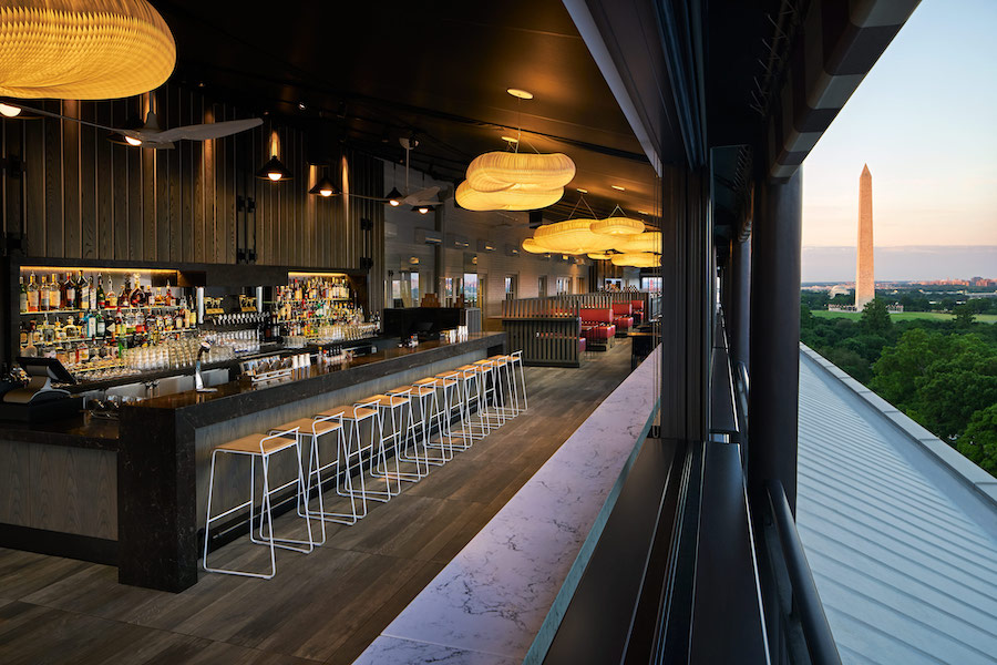 VUE rooftop bar at Hotel Washington offers sweeping views of the Washington Monument with modern interior design and stylish evening ambiance.