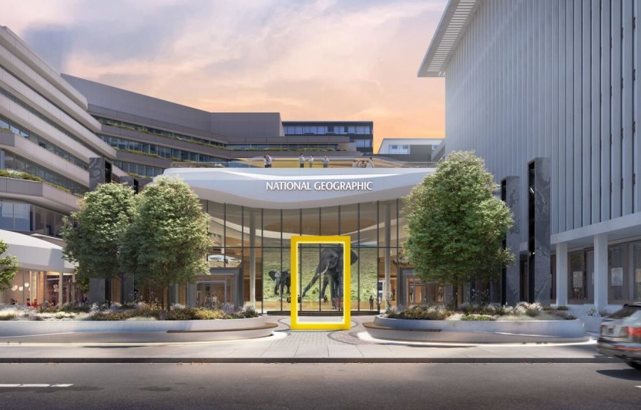 Exterior of the National Geographic Museum featuring its iconic yellow rectangle and glass entrance.